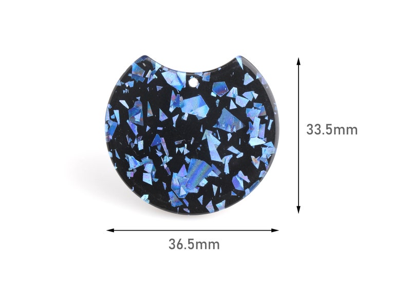 May include: A black resin half-circle pendant with a blue glitter finish. The pendant measures 36.5 mm wide and 33.5 mm high.