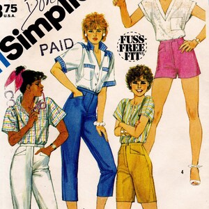 May include: A sewing pattern for four different styles of pants. The pattern is for a size 8 with a 24 inch waist. The pattern is called Simplicity and is labeled "Paid".