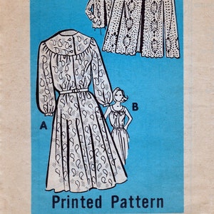 May include: A vintage sewing pattern for a dress and jacket. The pattern is printed on blue paper and features a white dress with a paisley print and a white jacket with a floral print. The pattern is labeled "Printed Pattern" and "9001 - SIZE 12".