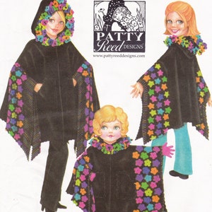 May include: Three children's hooded capes with colorful flower and star trim. The capes are black with a contrasting trim. The trim is made of felt and is sewn onto the cape. The capes are designed by Patty Reed Designs.