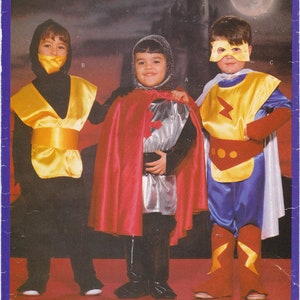 May include: A sewing pattern for three children's costumes: a black ninja costume, a red and silver knight costume, and a yellow and blue superhero costume. The pattern is from Butterick and the number is 5660.