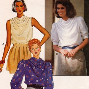May include: A sewing pattern for a blouse with three different styles. The first style is a sleeveless blouse with a cowl neck. The second style is a blouse with a cowl neck and short sleeves. The third style is a blouse with a cowl neck and long sleeves with puffed shoulders.