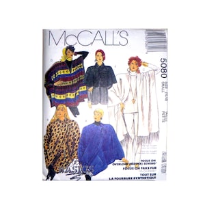 May include: McCall's sewing pattern for a poncho, featuring five different styles. The pattern is for sizes 10-12, small, petite. The pattern includes instructions for overlock serger sewing, fake fur, and tips on sewing with synthetic fur.