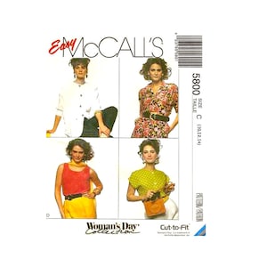 May include: A sewing pattern for a women's blouse and top. The pattern is from McCall's and is part of the Woman's Day Collection. The pattern is for sizes 10, 12, and 14. The pattern is called "Cut-to-Fit".
