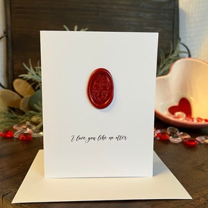 Carte de voeux d'amour de loutre, « Je t'aime comme aucune loutre », loutres se tenant la main, Saint-Valentin