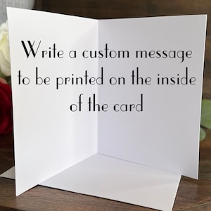 May include: A white greeting card, open to display the inside. The text on the left side of the card reads: "Write a custom message to be printed on the inside of the card."