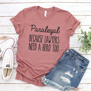 Paralegal, because lawyers need a hero too Unisex Tee Shirt