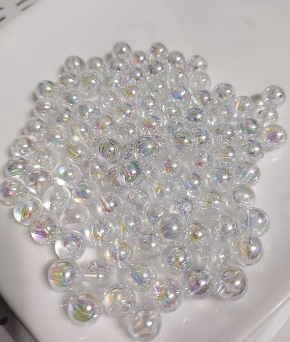 Bead, iridescent glass, translucent matte clear, 8mm round. Sold per  15-1/2 to 16 strand. - Fire Mountain Gems and Beads