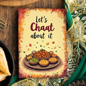 May include: A yellow and orange watercolour background with a white text overlay that says "Let's Chaat about it". The image features a colourful illustration of a plate of Indian street food called chaat.
