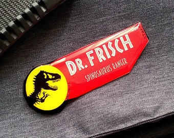 Personalized JURASSIC STAFF Name Tag. Custom dinosaur park employee badge. Cosplay gift accessory, uniform or costume pin or magnet. RED