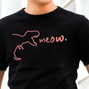 T-Rex Meowing t-shirt. Funny Tyrannosaurus Rex roaring tee. Gift for dinosaur nerds, museum trip or gag gift for cat lovers. Line art style