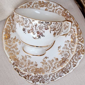Vintage English Fine Bone China trio -  white with gilt rosess pattern. 22kt Gold