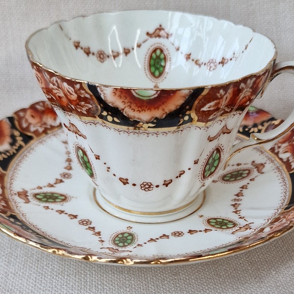Royal Albert Crown China, Cup and Saucer in hand painted Imari design.