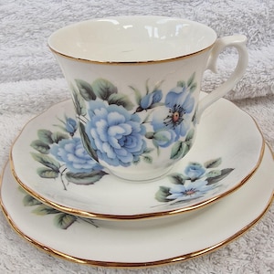 Queen Anne bone china trio in beautiful Ice Blue Roses pattern.