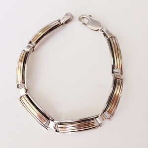 Classic Contemporary Navajo Sterling silver and 14K Gold link bracket designed by MM Rogers