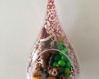Drop-shaped Christmas ball with teddy bear and their Christmas tree