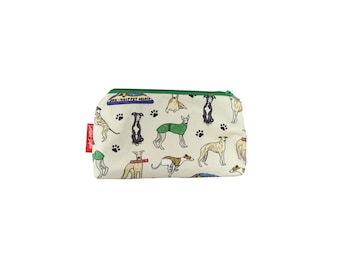 May include: A rectangular, off-white zippered pouch with a green zipper and a red tag. The pouch is patterned with various dog breeds, paw prints, and the text "-WHIPPET SALON-".