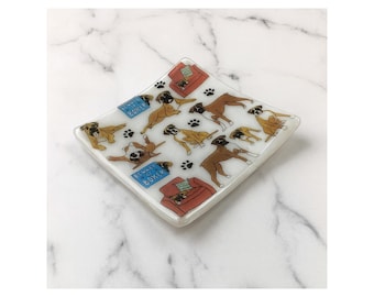May include: Square glass dish with a repeating pattern of boxer dogs in various poses, paw prints, and small red couches. The dish has the text "Beware of Boxer" on a blue sign.