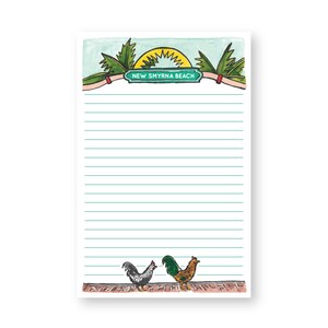 May include: A lined notepad with a green and yellow illustration of a palm tree and a sun. The notepad has the text "NEW SMYRNA BEACH" on a green sign. The bottom of the notepad has a black and white rooster and a green and brown rooster.