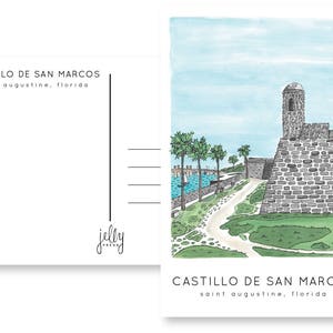 May include: A watercolor illustration of Castillo de San Marcos, a historic fort in St. Augustine, Florida. The fort is depicted in gray stone with a tall tower and a path leading to it. Palm trees and green grass surround the fort.