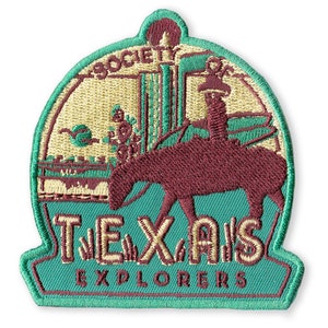 May include: A green and brown embroidered patch with the text "Society of Texas Explorers" and an image of a cowboy riding a horse in front of a cityscape.