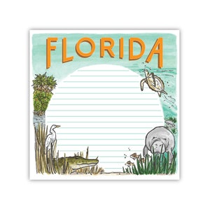 May include: A lined notepad with a watercolor background featuring a manatee, alligator, egret, and sea turtle. The notepad has the word "FLORIDA" written in orange at the top.