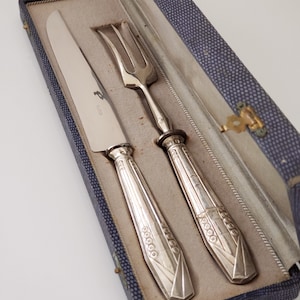 Silverware set with silver handles for chic and vintage tables, silver fork, silver knife, festive tableware.