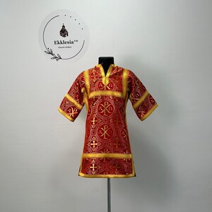May include: Red and gold liturgical vestment with a cross pattern and the text "Ekklesia™ Church Clothes" on a white background.