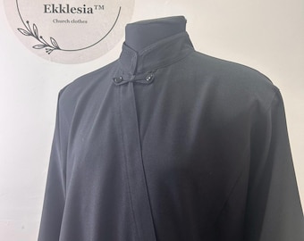 May include: A black long-sleeved shirt with a mandarin collar and button closure. The shirt has a simple design and is made of a smooth fabric.