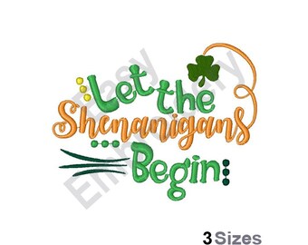 May include: A white background features the phrase "Let the Shenanigans Begin" in green and orange script. A green shamrock and decorative elements accent the text. The words "3 Sizes" are at the bottom.
