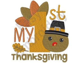 May include: Embroidered design featuring a turkey with a pilgrim hat, a large number "1", and the text "My 1st Thanksgiving". The turkey is brown with a red beak and black eyes. The number "1" is yellow and the text is brown.