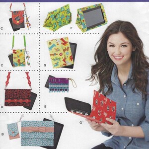 May include: Assortment of tablet and phone cases with various patterns and designs. Cases include a red and black floral design, a blue and pink floral design, a green and yellow design with dogs, a red and white design with a football team logo, and a purple and blue design with tassels.