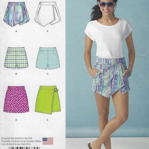 May include: A woman wearing a white top and patterned shorts. The image also shows a sewing pattern with different skirt and shorts designs, including a wrap skirt, scalloped shorts, and polka dot skirt. The pattern is designed and printed in the USA.