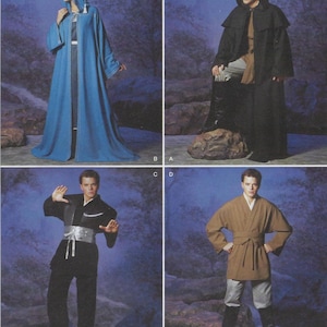 May include: Four costume designs are shown. A long blue hooded robe with white trim, a black hooded cloak, a black and silver costume with a white sash, and a brown robe with a belt, paired with gray pants and black boots.
