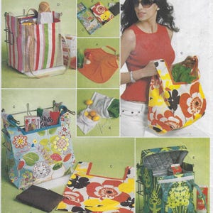 May include: An assortment of reusable shopping bags in various floral and geometric patterns. The bags are shown in different sizes and styles, including tote bags and insulated cooler bags. Some bags are filled with groceries.