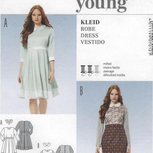 May include: A Burda Young sewing pattern featuring two dress designs. The first dress is a light green color with a white collar and cuffs. The second dress has a floral top and a patterned skirt. The pattern includes the words "KLEID, ROBE, DRESS, VESTIDO".