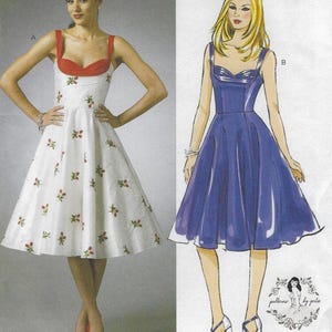 May include: Two dress patterns are shown. One is a white dress with red accents and floral embroidery. The other is a blue dress with a sweetheart neckline. Both dresses have a vintage style and are suitable for sewing.