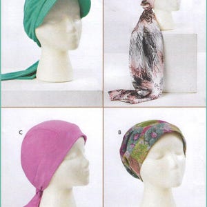 May include: Four head coverings displayed on white mannequin heads. Option D is a solid green cap with a visor and ties. Option A is a pink cap with a long, patterned scarf tail. Option C is a solid pink cap with ties. Option B is a floral print cap.