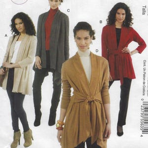 May include: A sewing pattern featuring four different knit cardigan designs. The cardigans are shown in beige, gray, red, and tan. The pattern includes the text "KNITS" and "Nancy Zieman thirty minutes to sew".