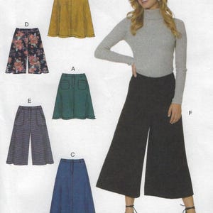 May include: A woman wearing a gray turtleneck sweater and black culottes. The image also shows several skirt and pants patterns in various colors and patterns, including green, yellow, floral, and blue. The patterns are displayed on a white background.