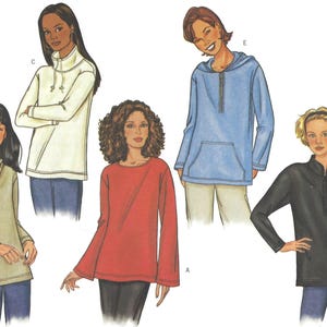 May include: A collection of five long-sleeved tops featuring various necklines and styles. The garments include a beige cowl neck, a white funnel neck with drawstrings, a red crew neck, a blue hooded pullover with a front pocket, and a black zip-up top.