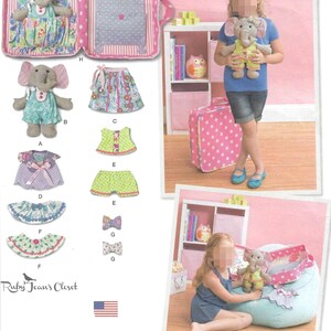 May include: A sewing pattern for a stuffed elephant toy and various doll clothes including dresses, skirts, shorts, and bows. The set features a pink polka-dot carrying case that opens into a play area. The Ruby Jean's Closet logo is visible.