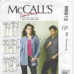 May include: McCall's M6613 sewing pattern featuring shirt designs. The pattern includes size measurements in inches and centimeters. The cover shows a woman and a man modeling the shirt styles. The text "Fashion That Fits" is displayed.
