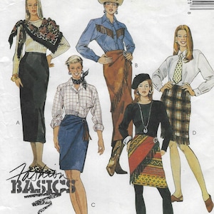 May include: A sewing pattern envelope titled Fashion Basics featuring illustrations of four different outfits. The designs include various skirts, blouses, a scarf, a necktie, and a beret, showcasing diverse patterns, fringe details, and wrap-style skirt silhouettes.
