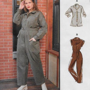 May include: A woman wearing a long-sleeved olive green jumpsuit with a belt, white shoes, and a collared neckline. The image also shows two jumpsuit design illustrations. The text "Designed and printed in USA" is visible.