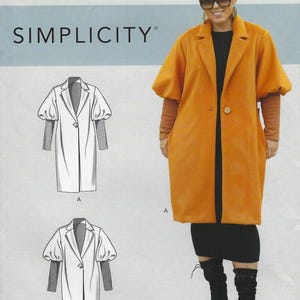 May include: An orange coat with large sleeves and a single button closure. The image also shows a black dress and boots. The text "SIMPLICITY" is visible at the top of the image, along with size information.