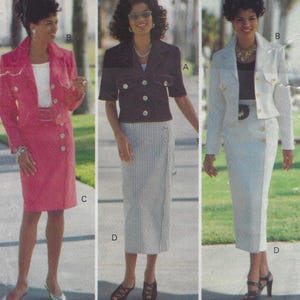 May include: Three women are wearing different variations of a skirt suit. The first woman is wearing a pink skirt suit with a white top. The second woman is wearing a black and white striped skirt with a black jacket. The third woman is wearing a white skirt suit with a black top.