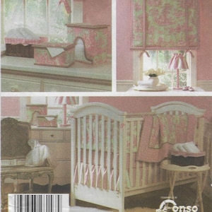May include: A nursery set featuring a crib, window treatments, and decorative storage boxes. The items have a pink and green floral pattern. The crib has a white frame and matching bedding. The room has a soft, feminine aesthetic.