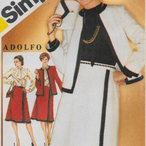May include: Simplicity sewing pattern featuring an Adolfo design. The main image showcases a woman in a white skirt suit with black trim and a black top. The pattern also includes illustrations of red skirt suits.