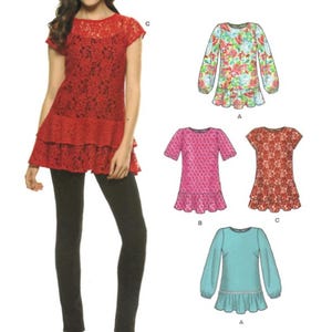 May include: A sewing pattern envelope featuring a red lace tunic with a tiered hem, labeled C. Illustrations show variations including a floral long-sleeve top, a pink short-sleeve top, a red lace top, and a solid teal long-sleeve top with the text easy.